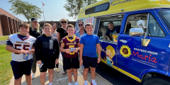 Troy students and staff pose for photo in front of ice cream truck