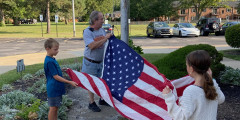 Westview fourth grade students help to raise the American flag