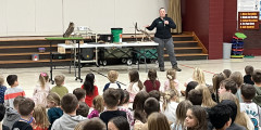 Redwood students watch nature assembly in gym