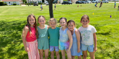 Eastview students standing on front lawn of the school. 