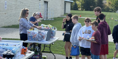 Learwood PTA volunteers help hand out snacks to Learwood students