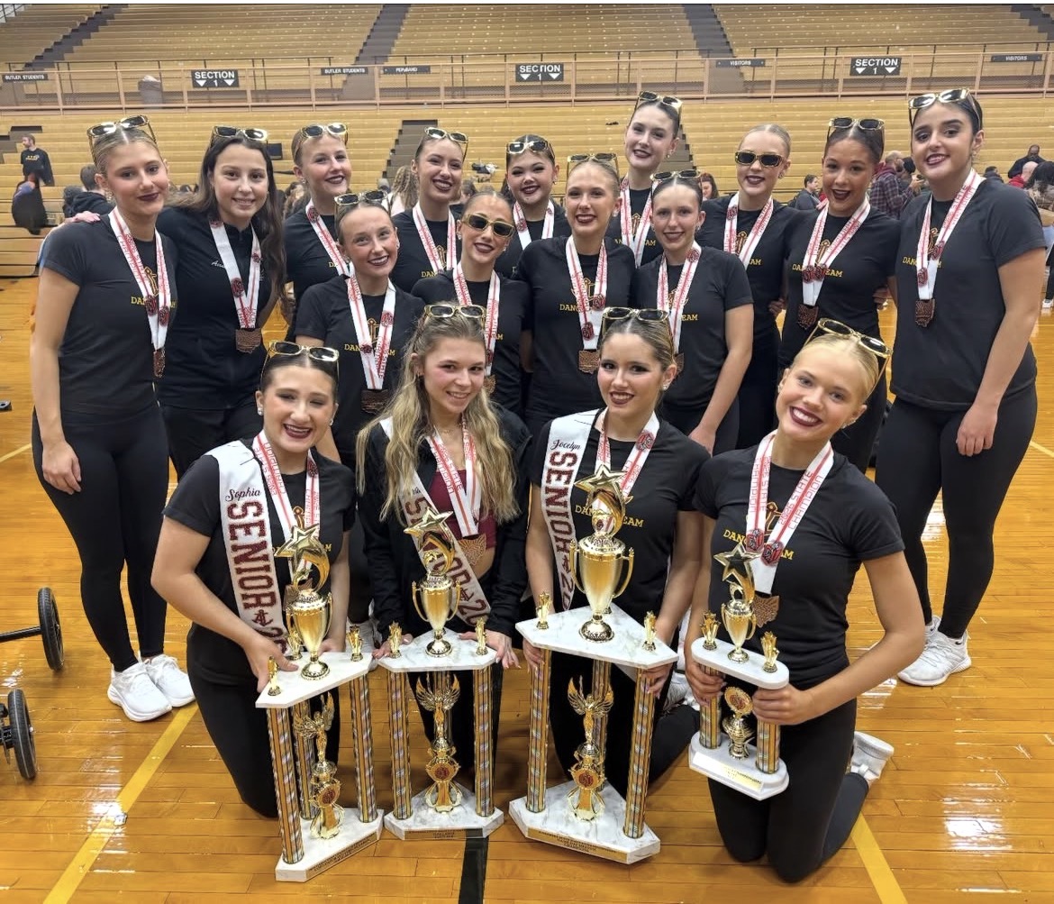 ALHS Dance Team group photo holding 2026 state title trophies