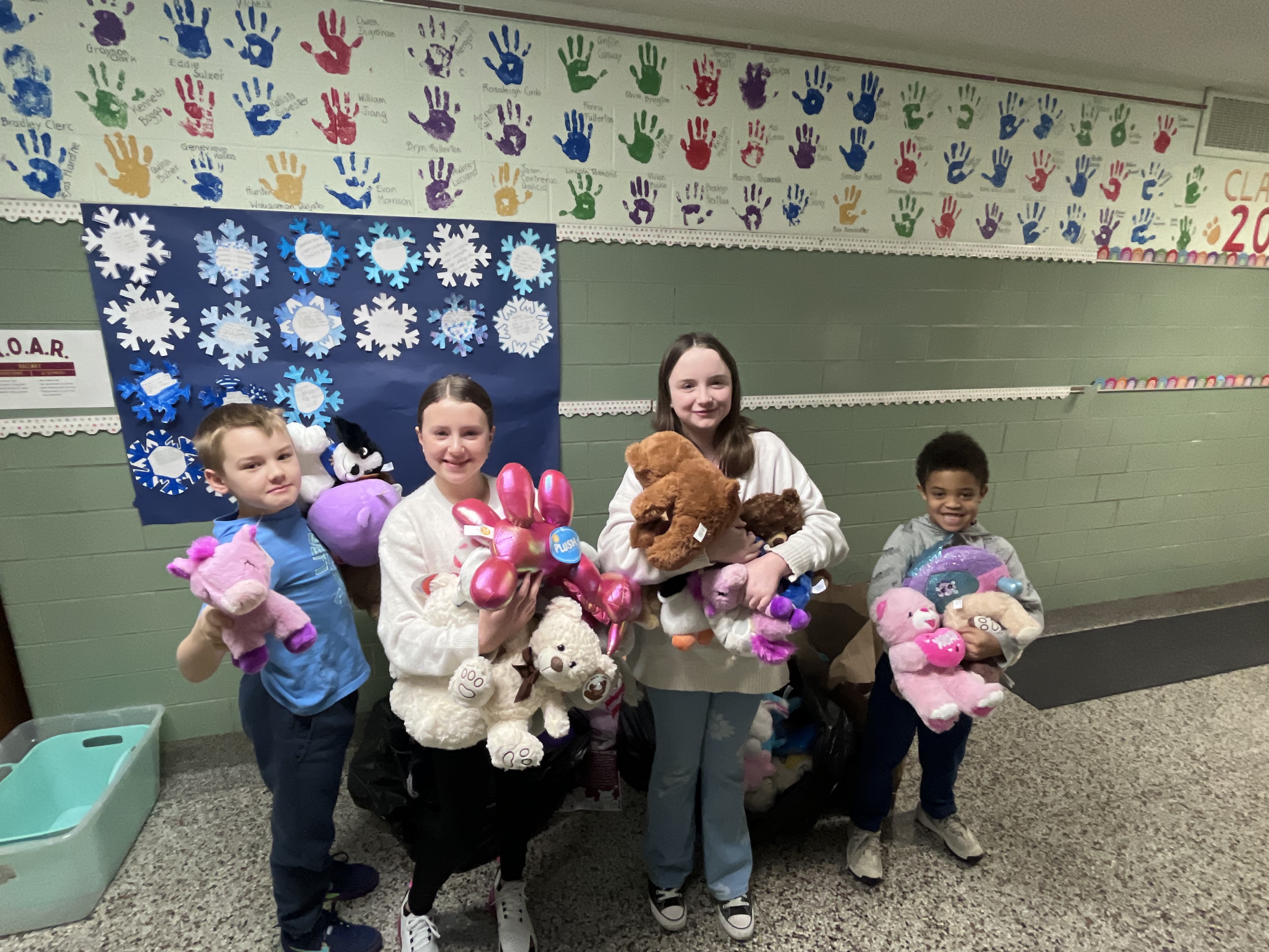 Westview students hold donated stuffed animals