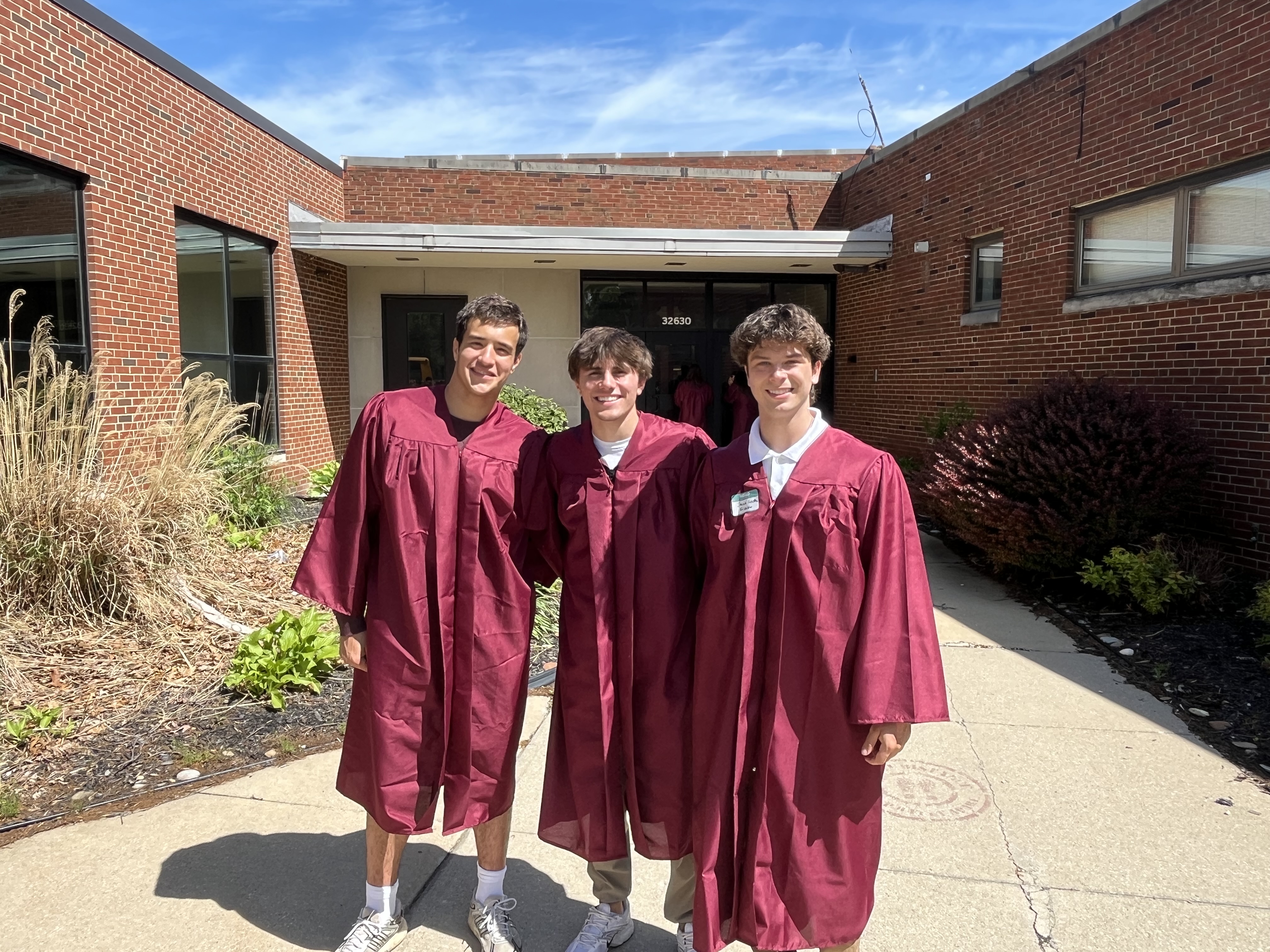 ALHS Class of 2026 members stand outside site of Erieview Elementary