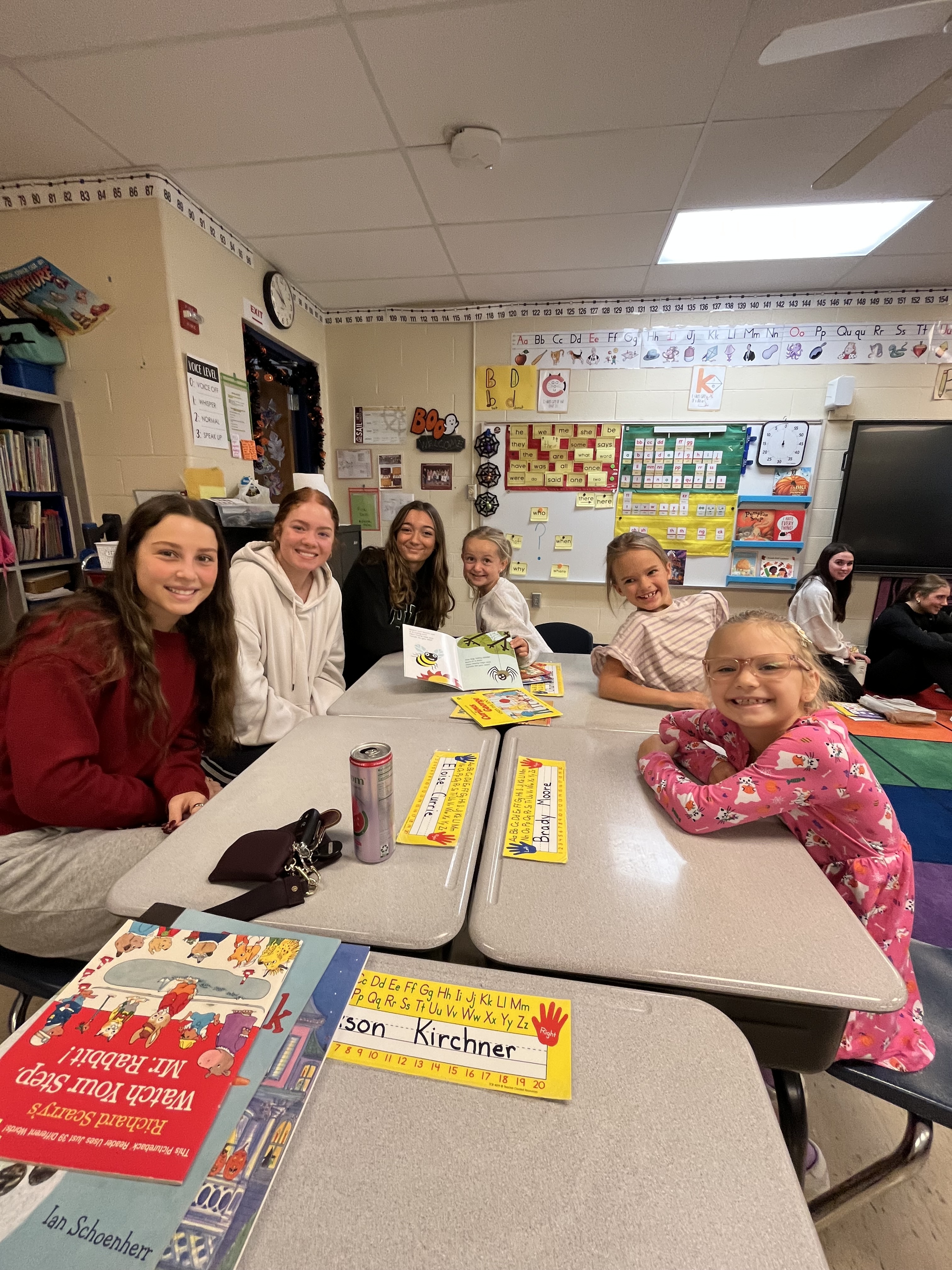 NEHS students and Eastview students sit at table together