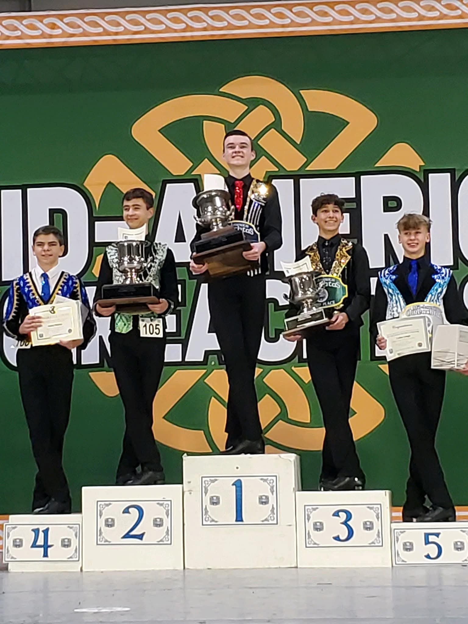 ALHS student Connor Lardie holds trophy on winners podium